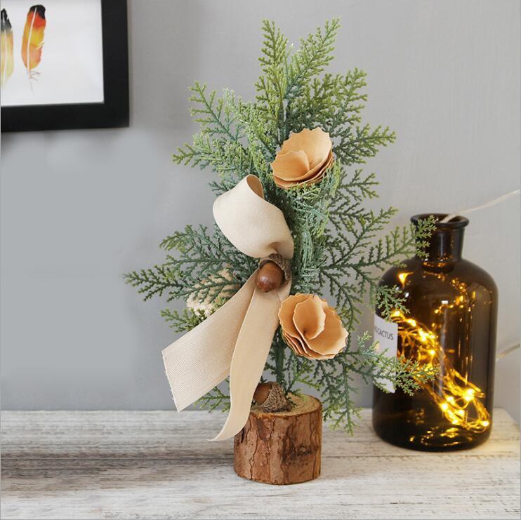 Artificial Christmas Tree Decorations featuring jute wrapping, red berries, and pine cones